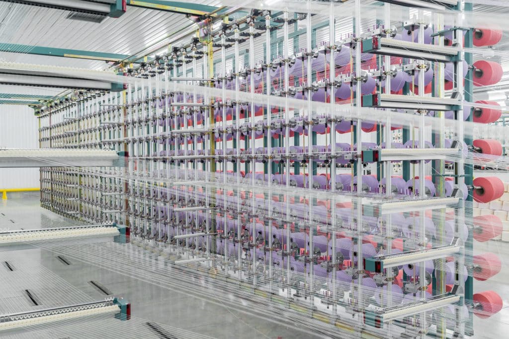 What is crochet thread? 2 Yarn on a textile processing machine.